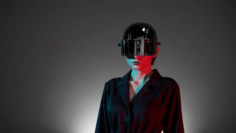 woman in futuristic vr helmet with neon lights