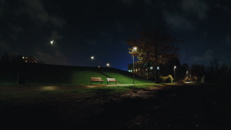 sitting bench inside pae park at night, tallinn, estonia