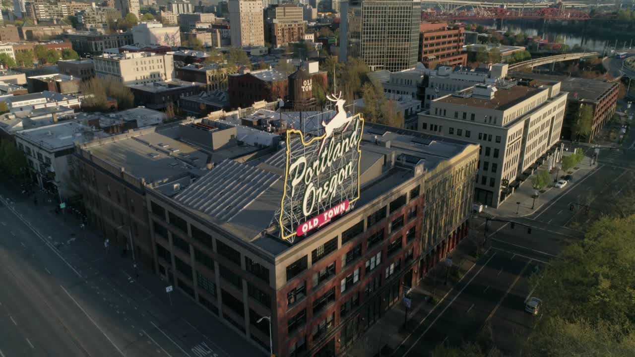Historic aerial of Portland, Oregon's iconic Old Town sign with empty streets due to COVID-19.