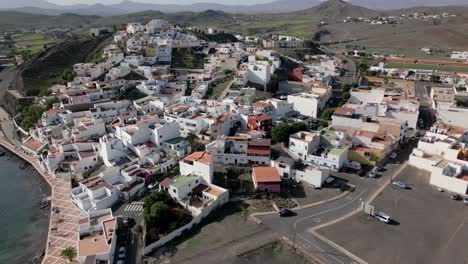 Aerial-fly-over-of-the-beautiful-town-of-Las-Playitas,-Spain