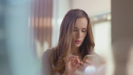 Woman-using-smartphone-at-home