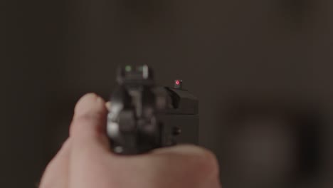 9mm handgun being aimed at something