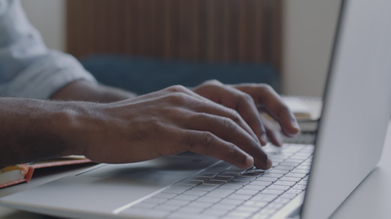 Person Typing on a Laptop