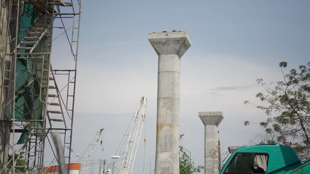 Construction of an elevated road or bridge with concrete pillars and scaffolding