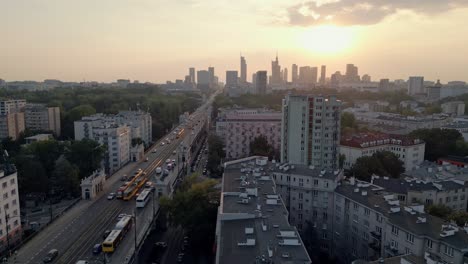 Evening-traffic-at-Jerusalem-Avenue-and-skyline-of-Warsaw-downtown,-Poland,-aerial-view