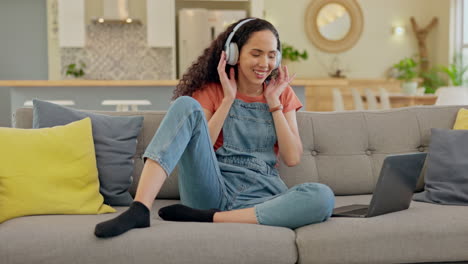 Headphones,-dance-and-woman-on-sofa