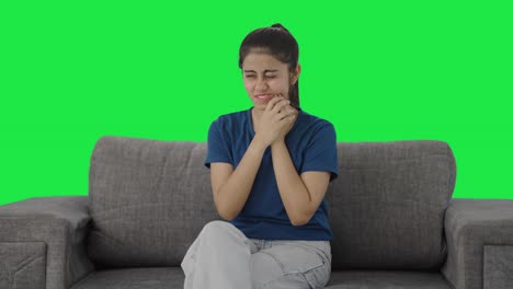 Indian-teenage-girl-having-a-tooth-ache-Green-screen