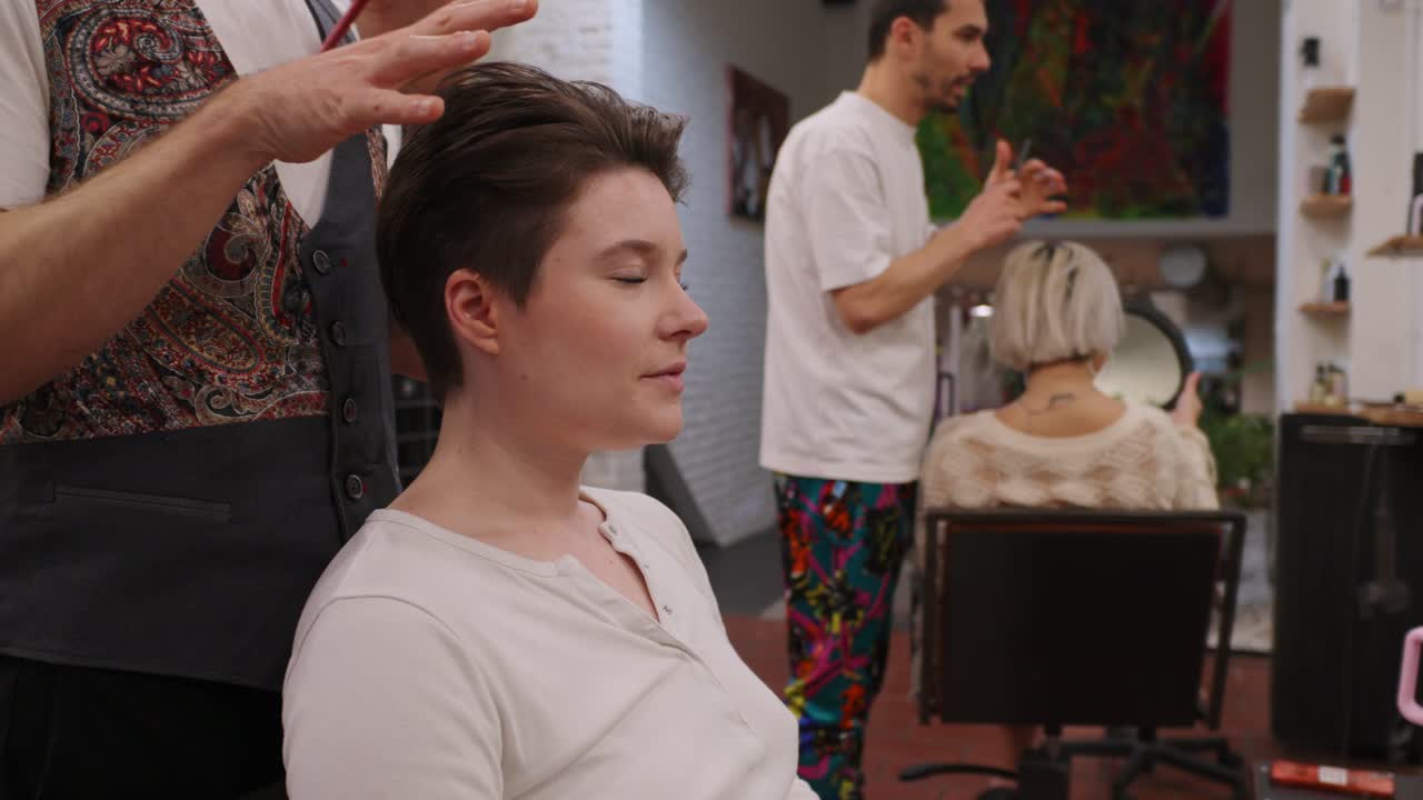 Woman getting a haircut at a hair salon