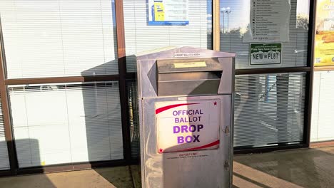 old woman drops mail-in ballot letter in slot at voting booth with offical ballot drop box sign for democratic government election in presidential race