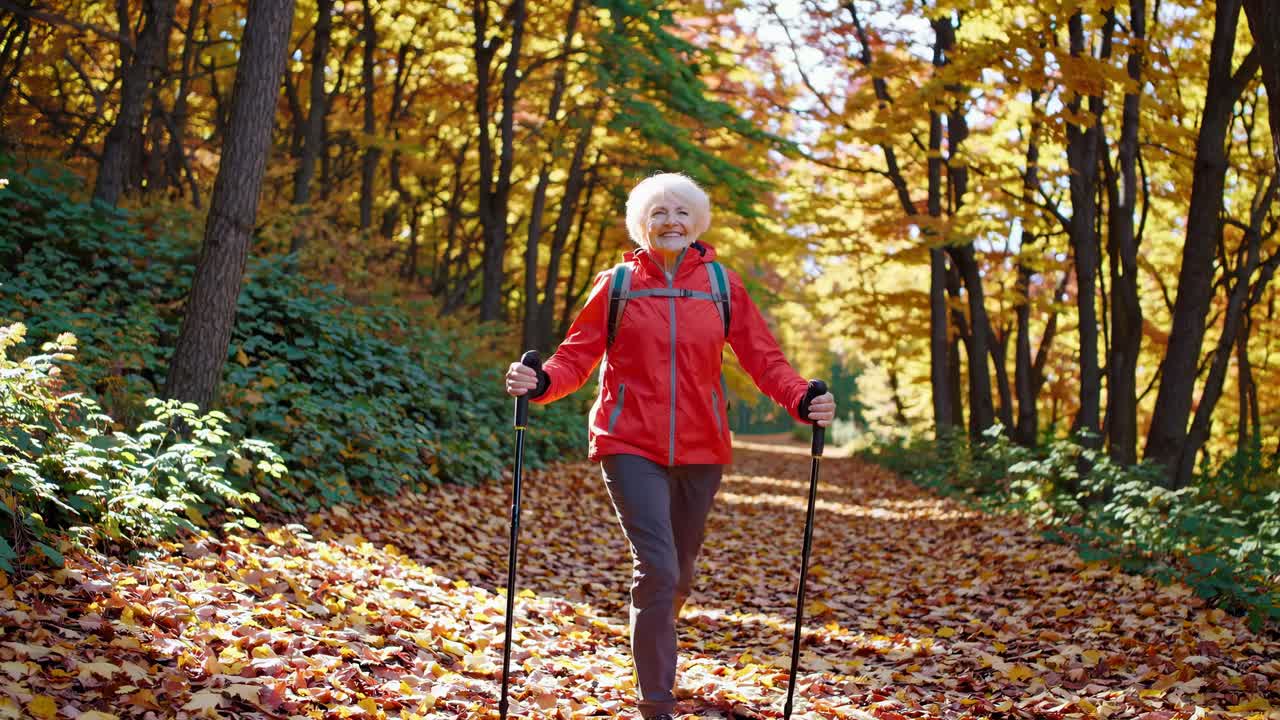 Senior Woman Hiking in Autumn Forest