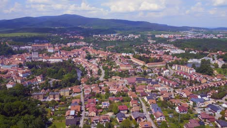 Stunning-aerial-top-view-flight-mountain-overview-Hill-town-Panorama,-Krumlov-Czech-Republic-Summer-2023