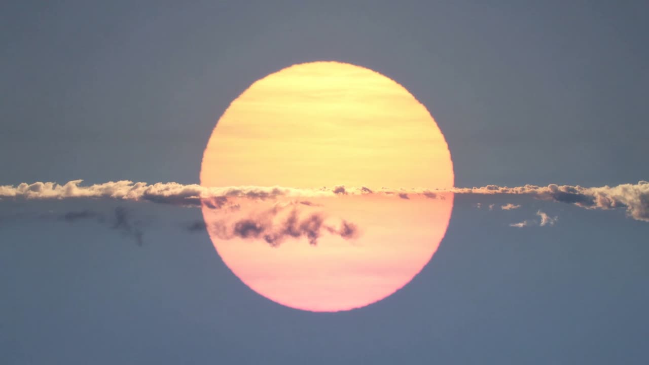 Sun staying centered while light wind causing cloud band drifting and patch shifting for astronomy