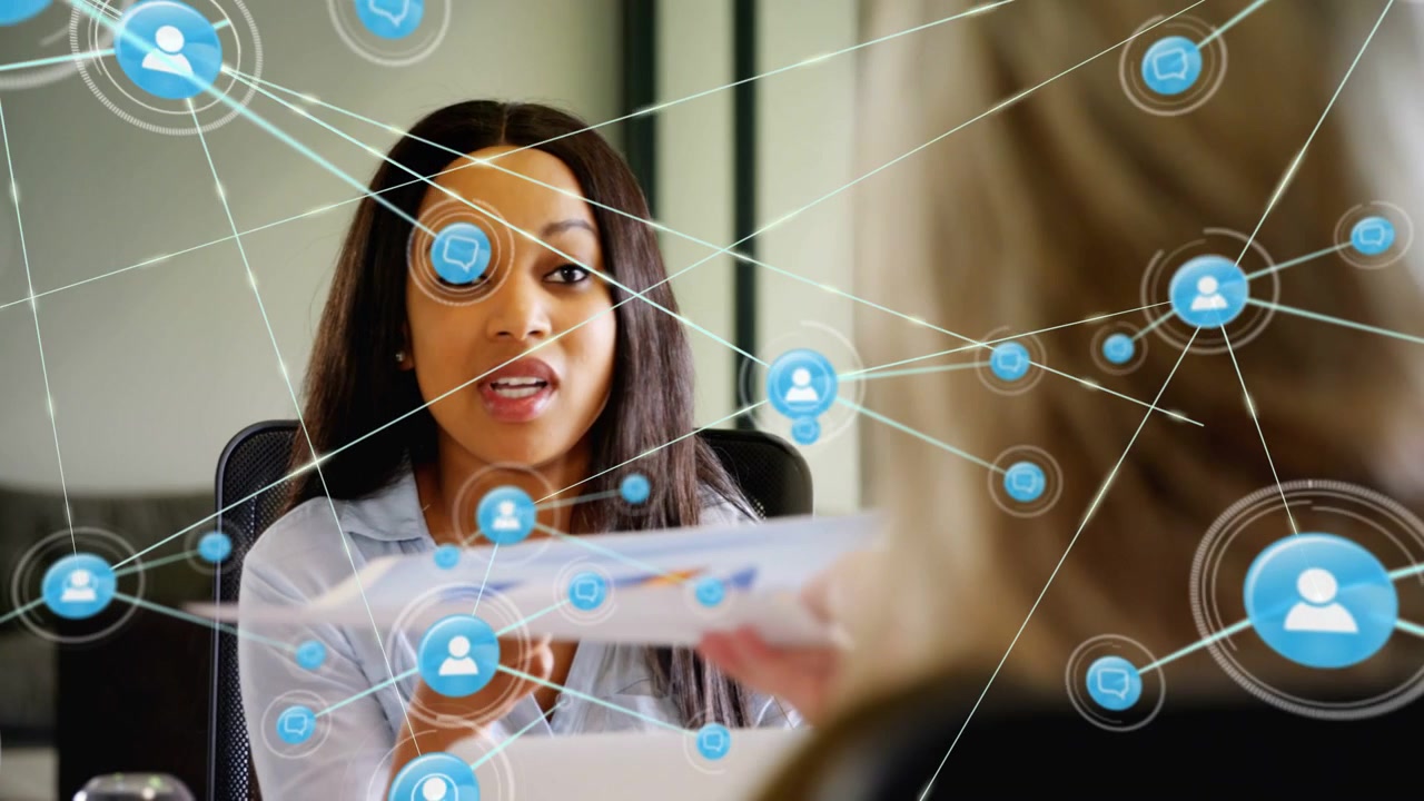 Seated woman offering business charts and presenting, speaking, initiating network overlay growth