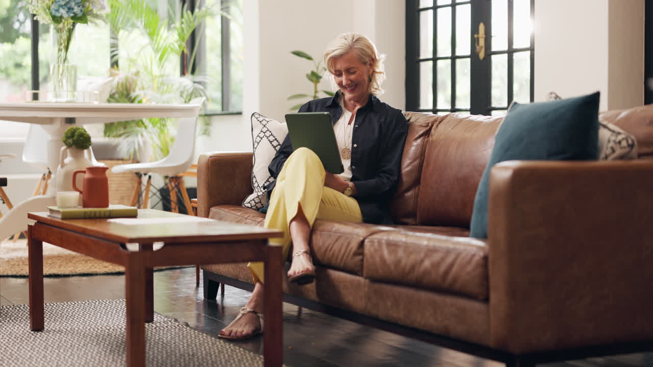 Woman relaxing at home with a tablet
