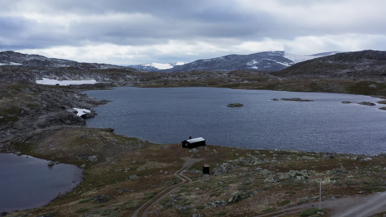Norwegian Mountain Lake with Cabin