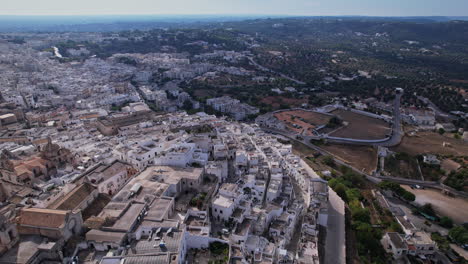 an aerial view of a ostuni italy with lots of buildings