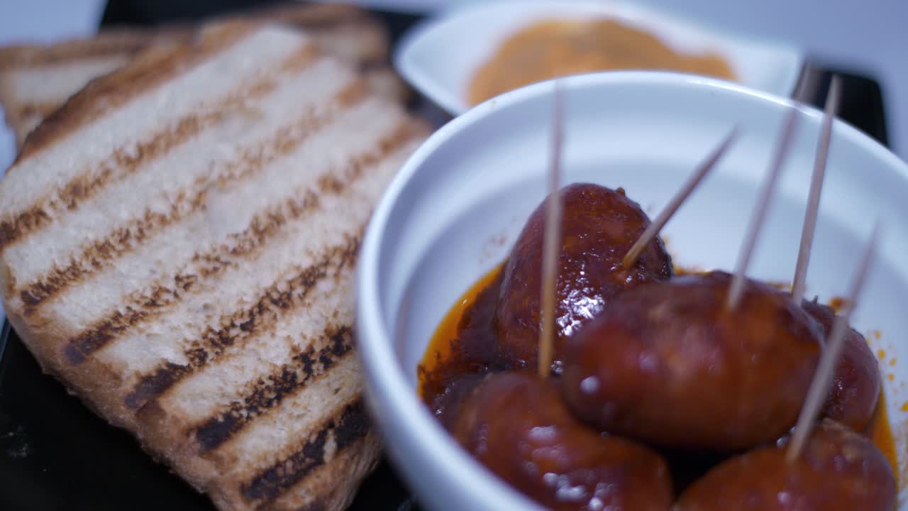 Spanish Tapas: Chorizo with Grilled Bread and Sauce