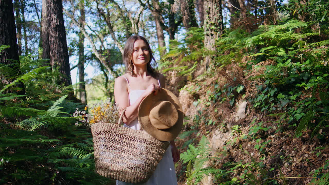 Lady enjoying sunshine forest overlooking plants closeup. Woman posing jungles