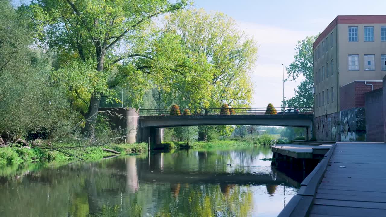 Scenic River Landscape with Bridge and Building