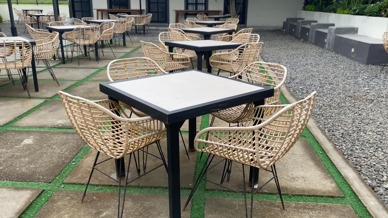 Comfortable rattan tables and chairs outdoors in a coffee shop, Interior footage