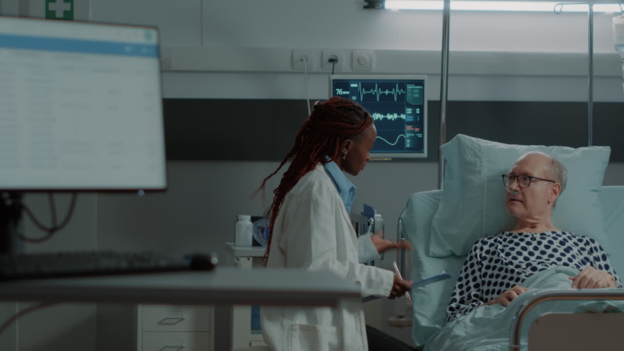 African american medic talking to nurse about patient diagnosis