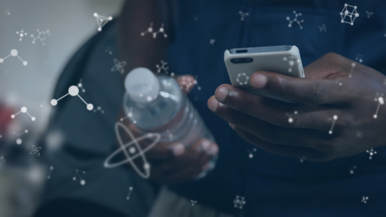 Animation of molecules over woman using smartphone