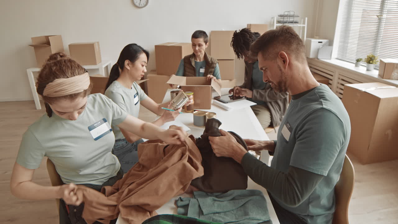 Volunteers packing donations in boxes