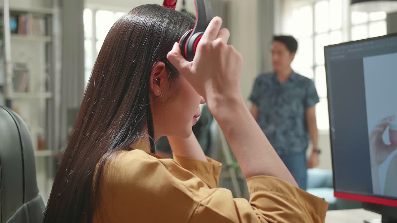 Asian Female Digital Editor Start Works In Photo Editing Software On Her Personal Computer With Big Display In Office