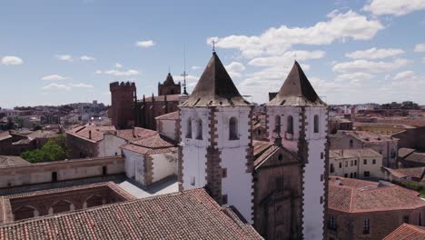 Aerial-view-orbiting-Cáceres-Iglesia-de-San-Francisco-Javier-baroque-catholic-church-whitewashed-bell-towers