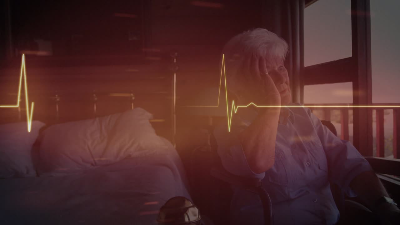 Animation of cardiograph over senior caucasian woman in wheelchair
