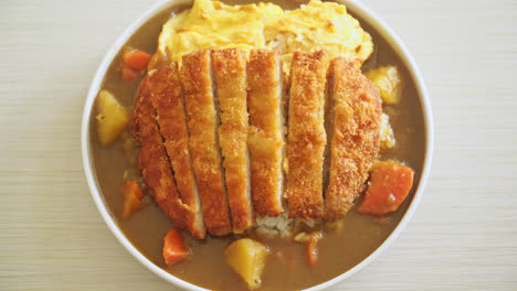 curry rice with tonkatsu fried pork cutlet and creamy omelet - japanese food style