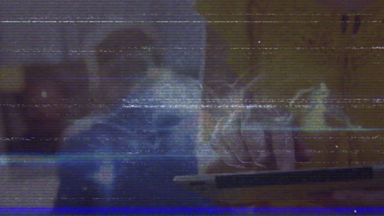Person Using Tablet with Glitchy Digital Interference Effect