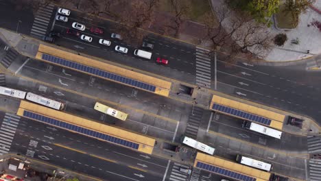 Aerial-top-down-descending-over-Chacarita-terminal-bus-station,-Buenos-Aires