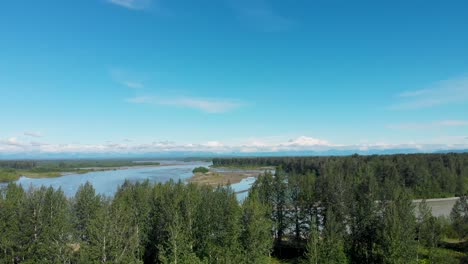 4k drone video of susitna river with denali mountain in distance on alaska summer day