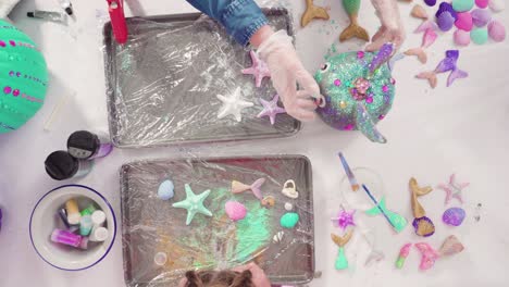 decorating art pumpkins with rhinestones, mermaid tails, and seashell