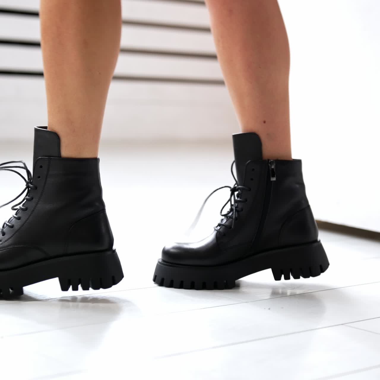 Woman shoes showroom posing. Lifestyle stylish footwear trying