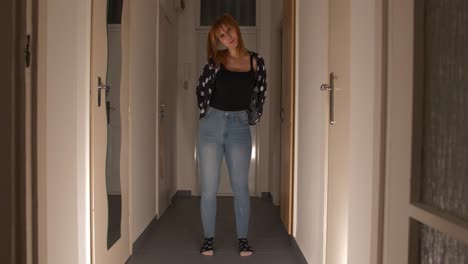 beautiful sexy and creepy girl showing 2 swords in the dark hallway, full shot
