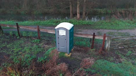 portable toilet by a canal