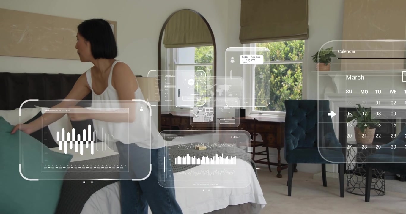 Man and woman arranging bedding, activating AR home decor panels, woman tapping, man smoothing rug