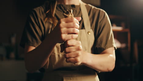 woman sculpting clay