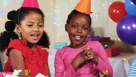 Animación-De-Confeti-Cayendo-Sobre-Diversos-Niños-Con-Gorros-De-Fiesta-En-Una-Fiesta-De-Cumpleaños.