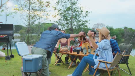 friends camping trip with music and drinks