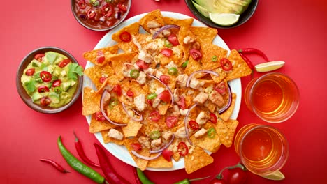 a plate of delicious tortilla nachos with melted cheese sauce  grilled chicken