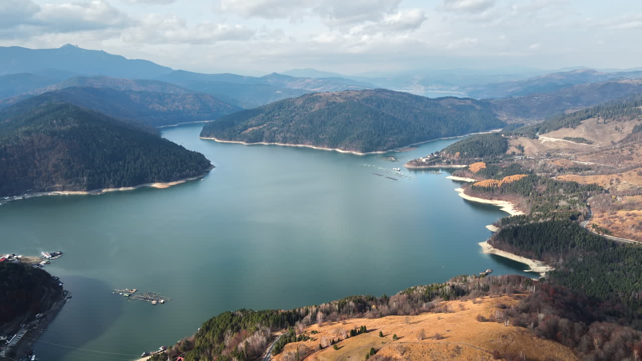 Aerial drone panoramic view of Bicaz lake in Romania. Carpathian mountains, hills covered with lush forest