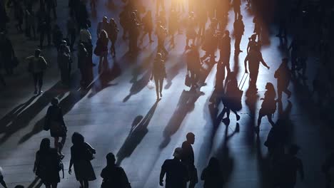 outlines of a crowd of commuters. shadows, unrecognizable people, dark