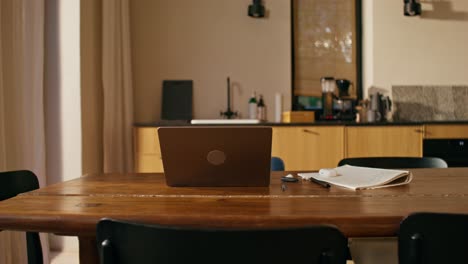 laptop on a wooden table in a home office