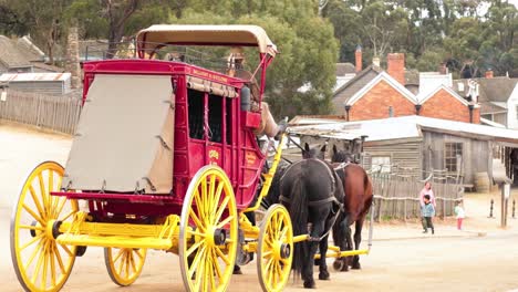 carriage moving through historical town setting