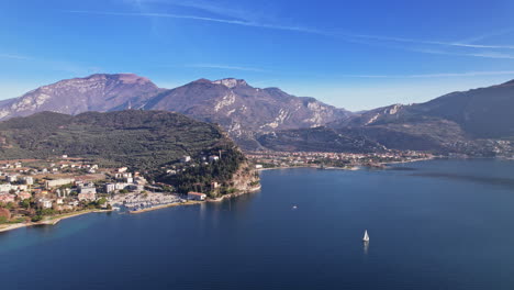 aerial view of lake surrounded by mountains in italy