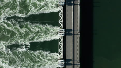 water from the opened eastern scheldt storm surge barrier at vrouwenpolder village in zeeland, netherlands