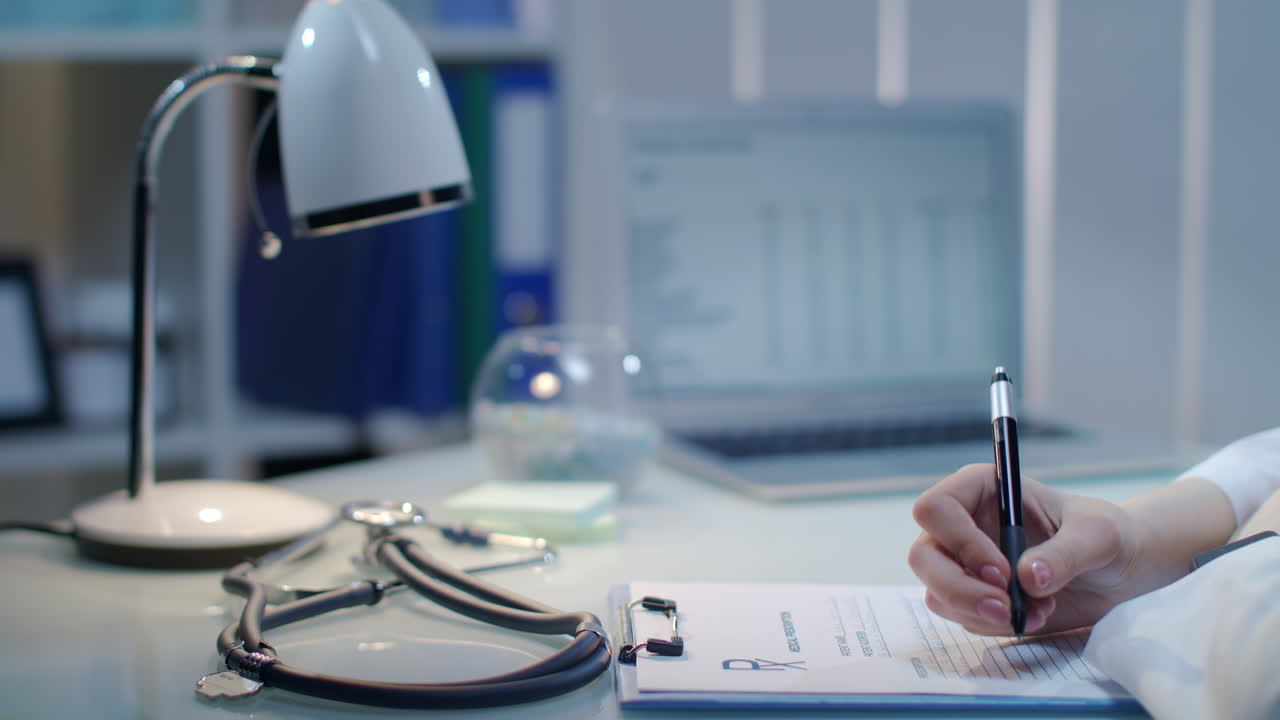 Doctor hand writing medical test result